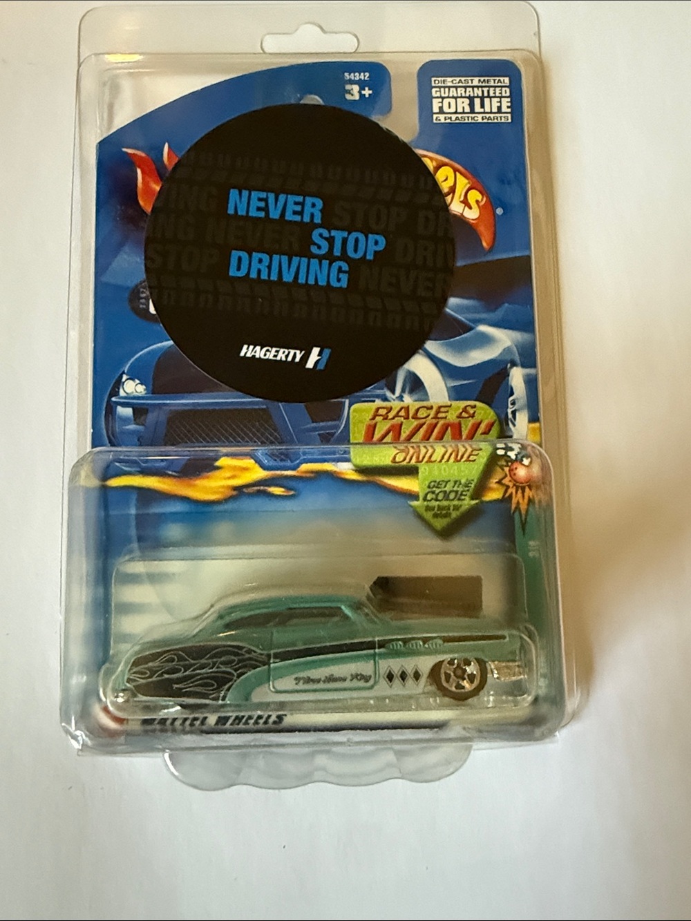 Hot Wheels Green Lowrider Die-Cast Car - 'Never Stop Driving' Packaging